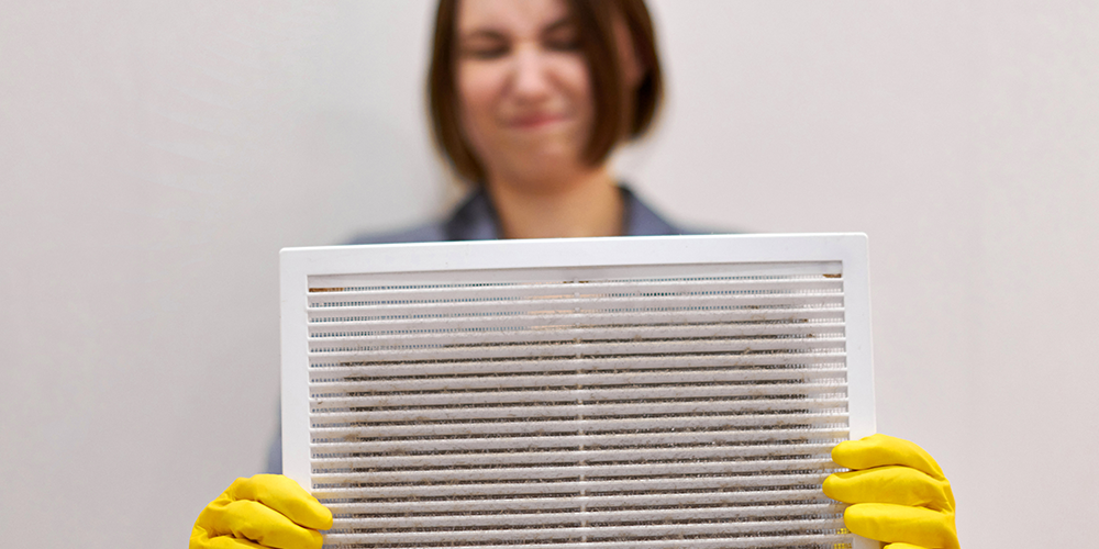 Woman holding dirty vent