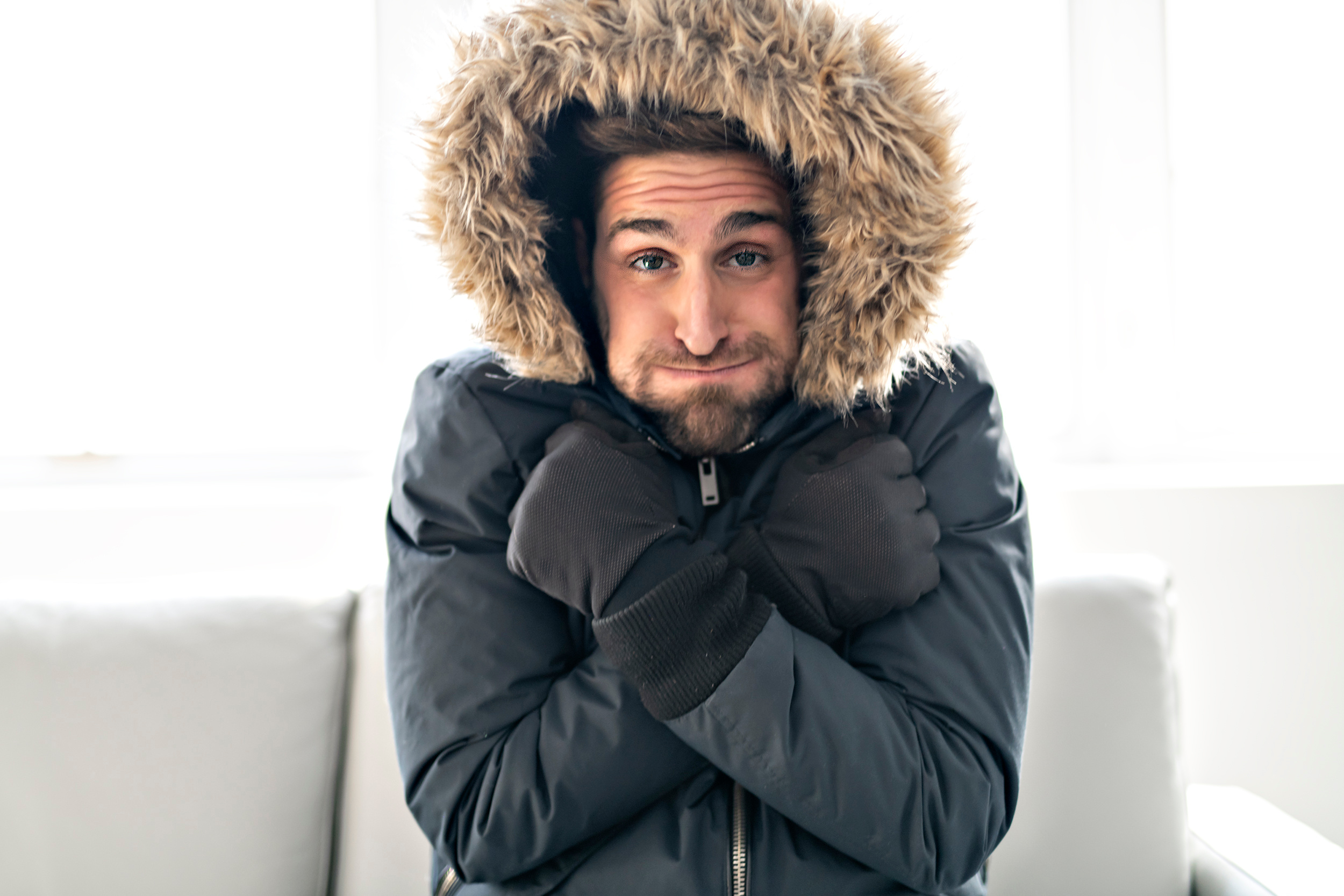 man wearing a coat indoors