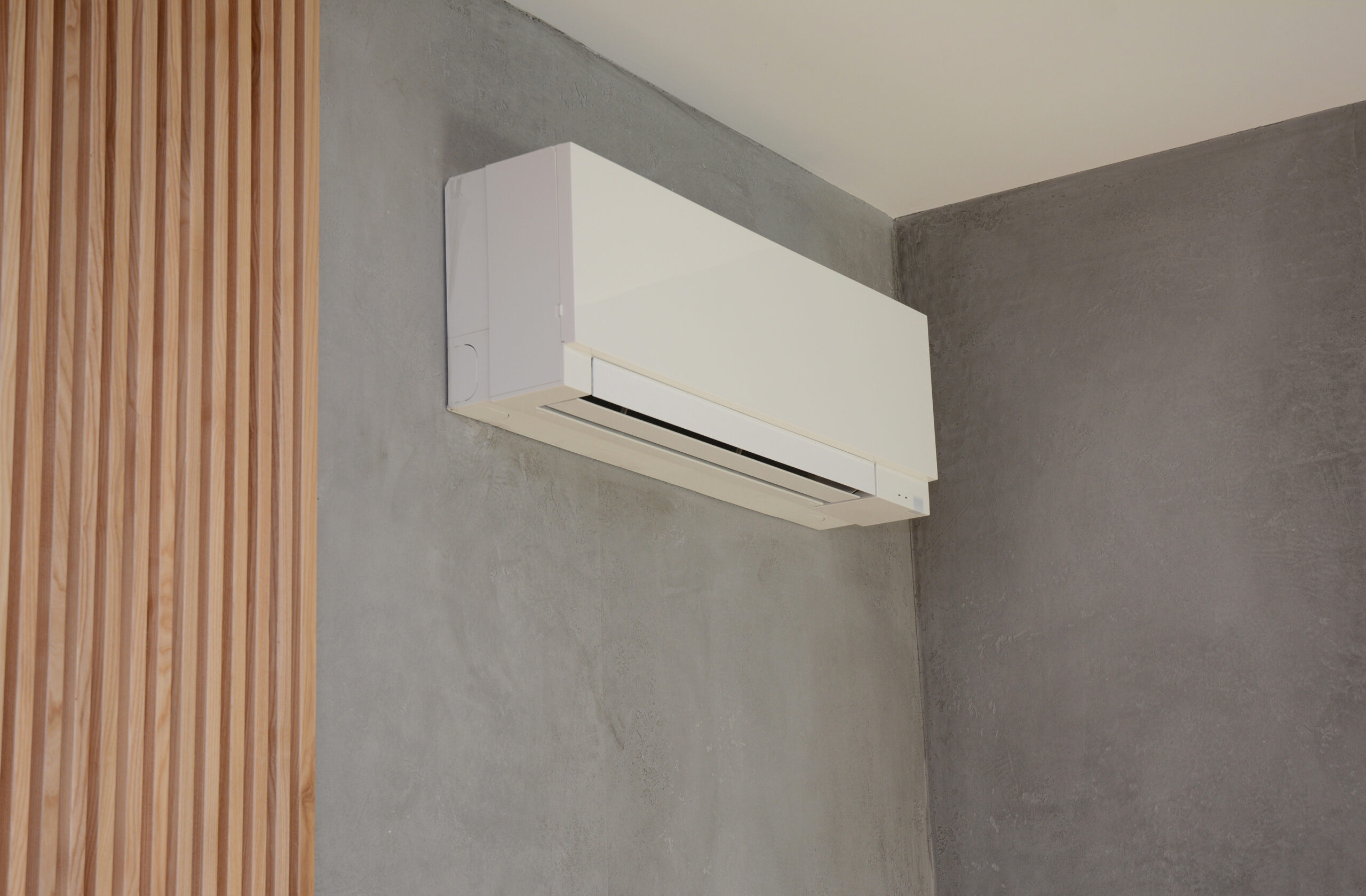 ductless mini split mounted on a wall